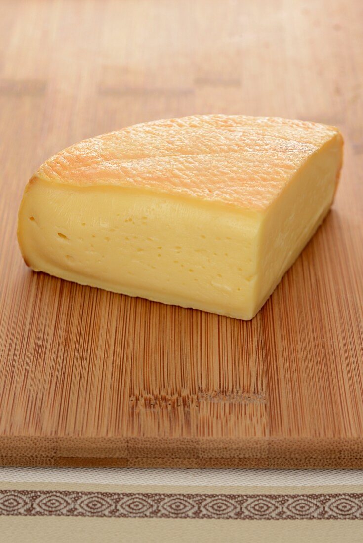 Munster cheese on a wooden board