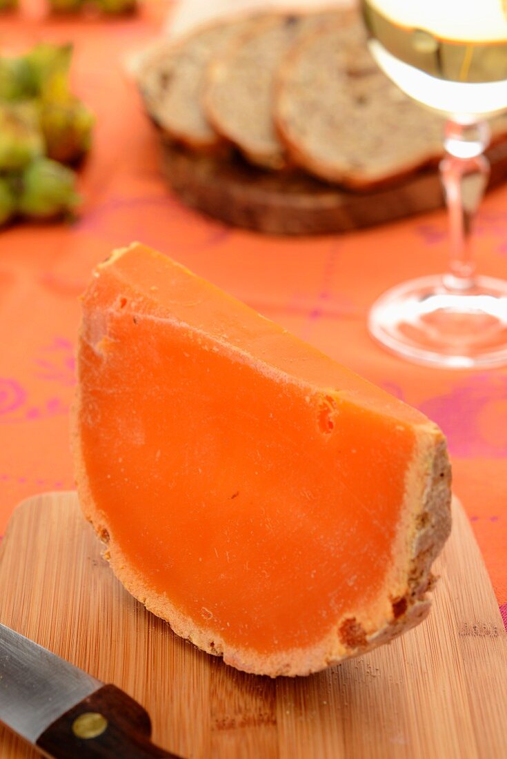 A slice of Mimolette cheese