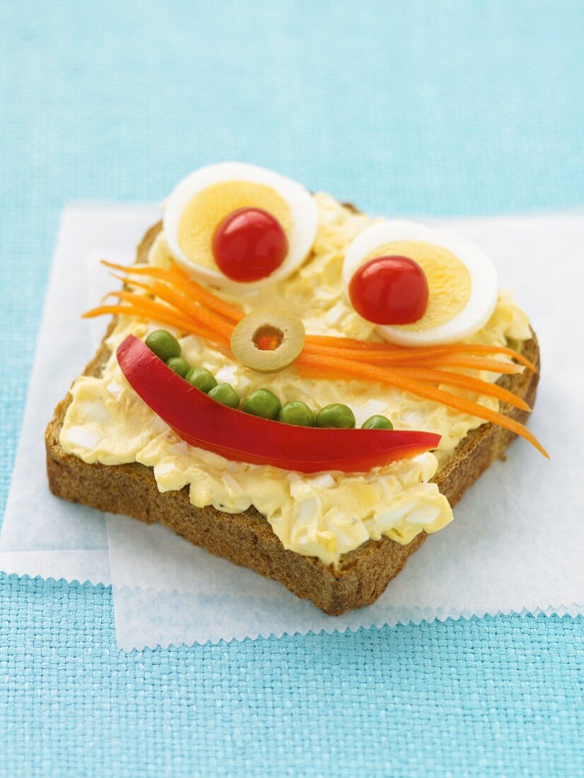 A slice of bread with a funny face
