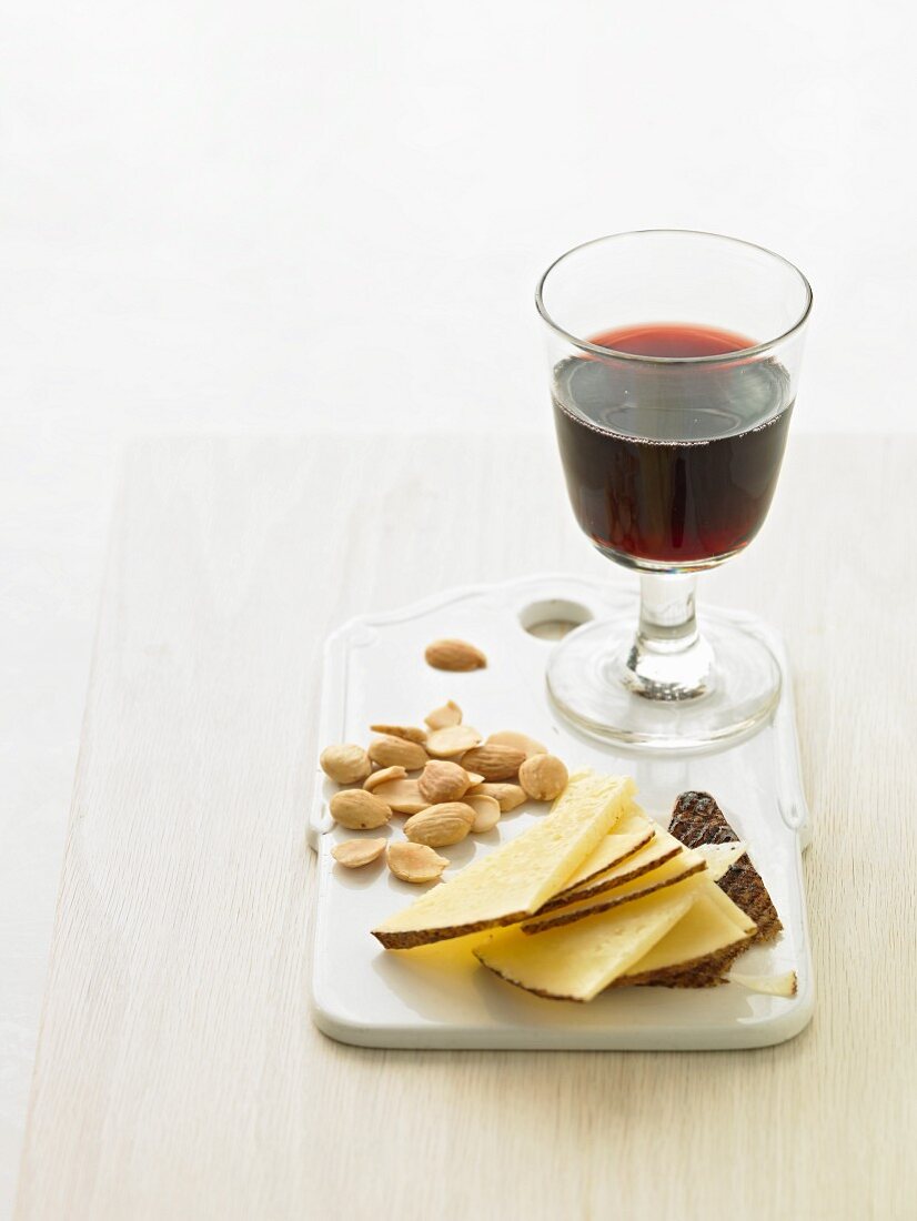 Cheese, nuts and a glass of red wine