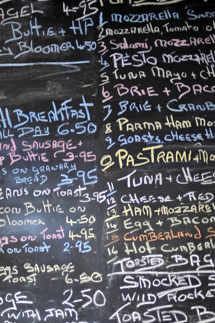 A handwritten menu on a blackboard