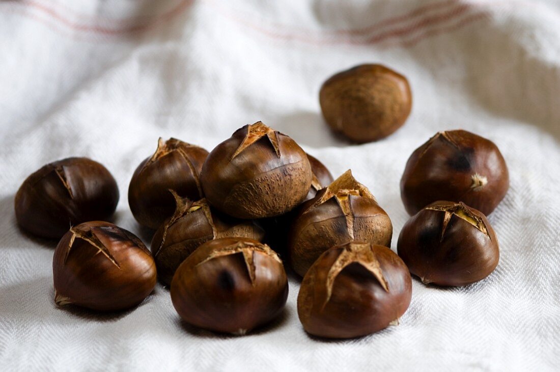 Roasted chestnuts on a tea towel