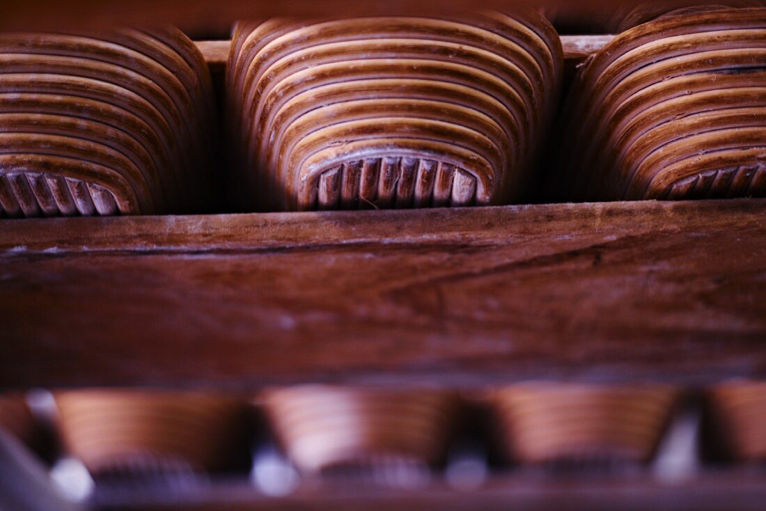 Bread baskets on a wooden shelf