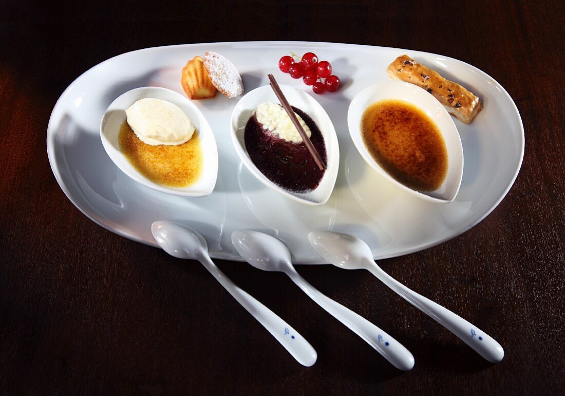 Three different flavours of creme brulee: tonka beans, cassis and vanilla