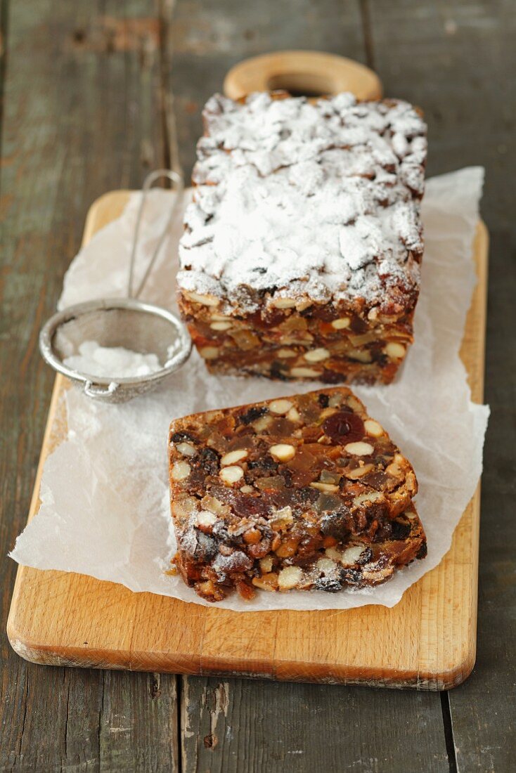 Fruit cake with nuts and icing sugar