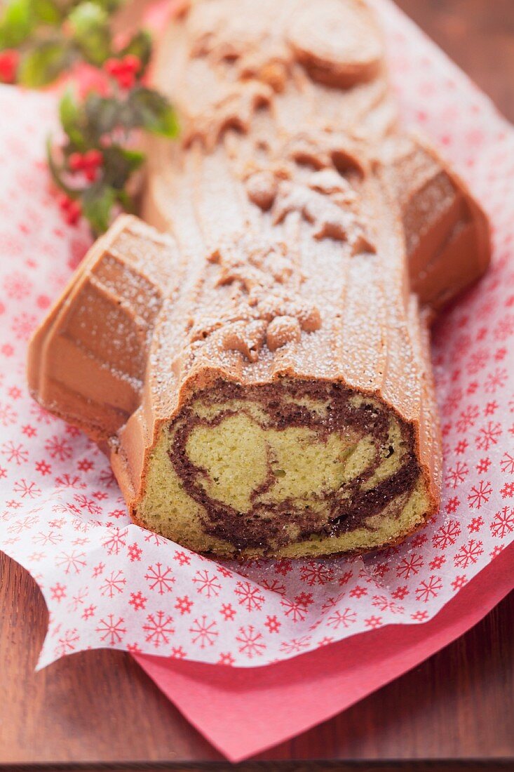 Christmas pistachio cake made using a log-shaped baking tin