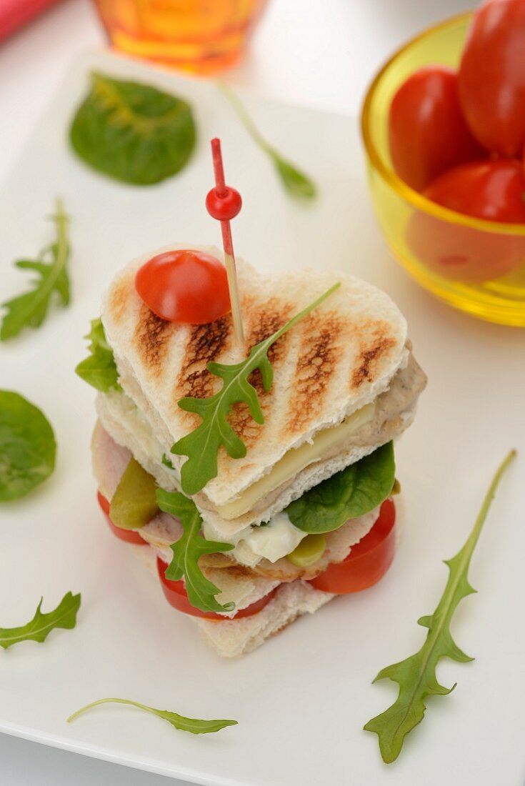 A heart-shaped club sandwich