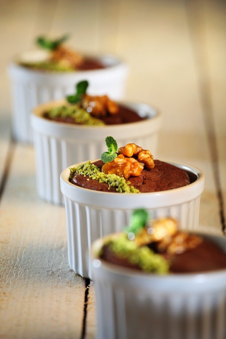 Mini chocolate cakes with walnuts and pistachios