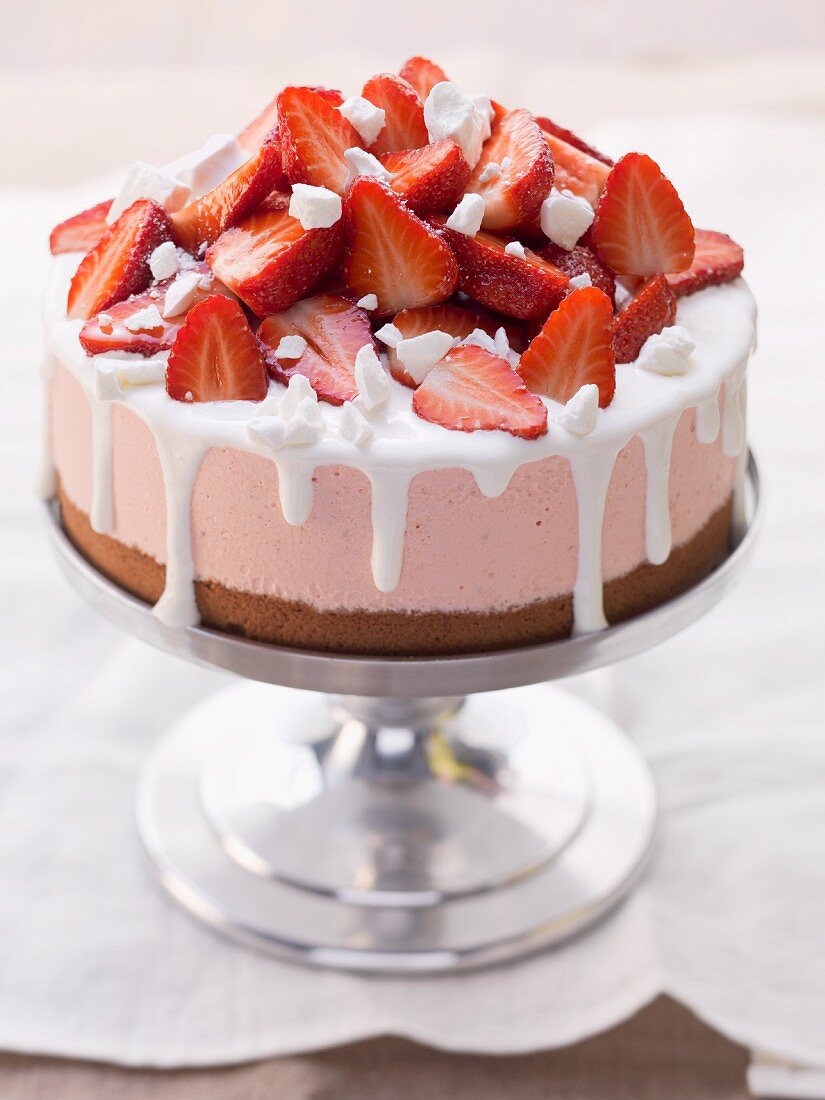 Strawberry ice cream cake on a cake stand