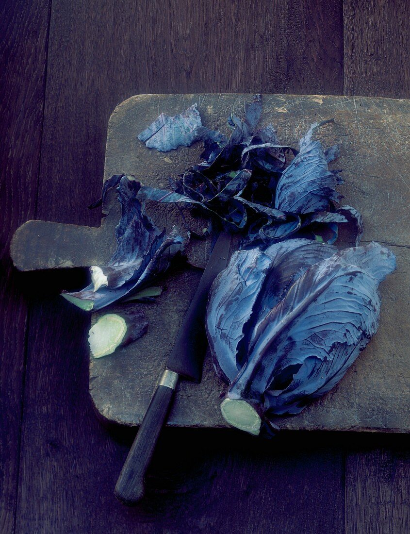 Red cabbage, sliced on a chopping board