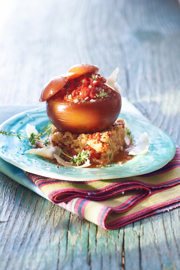 A stuffed Black Zebra tomato on a bed of spelt risotto