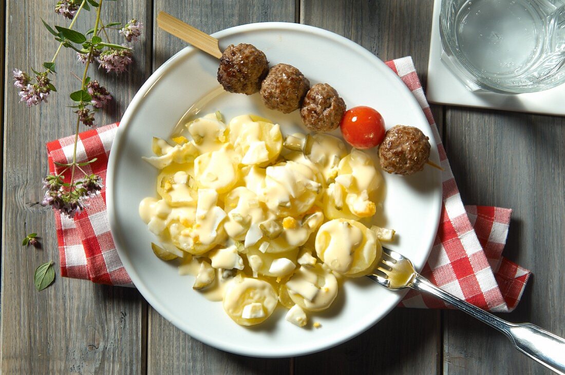 Potato salad with meatballs