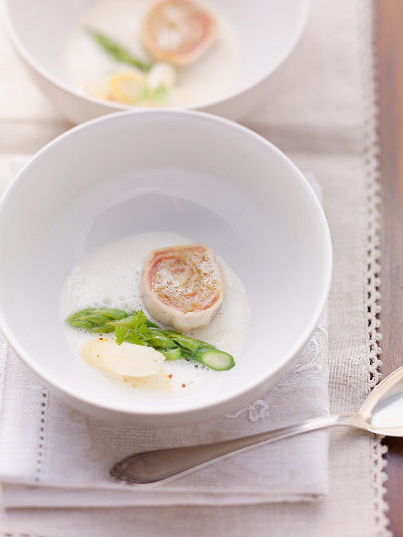 Asparagus soup with chocon de lait roulade and sauerkraut