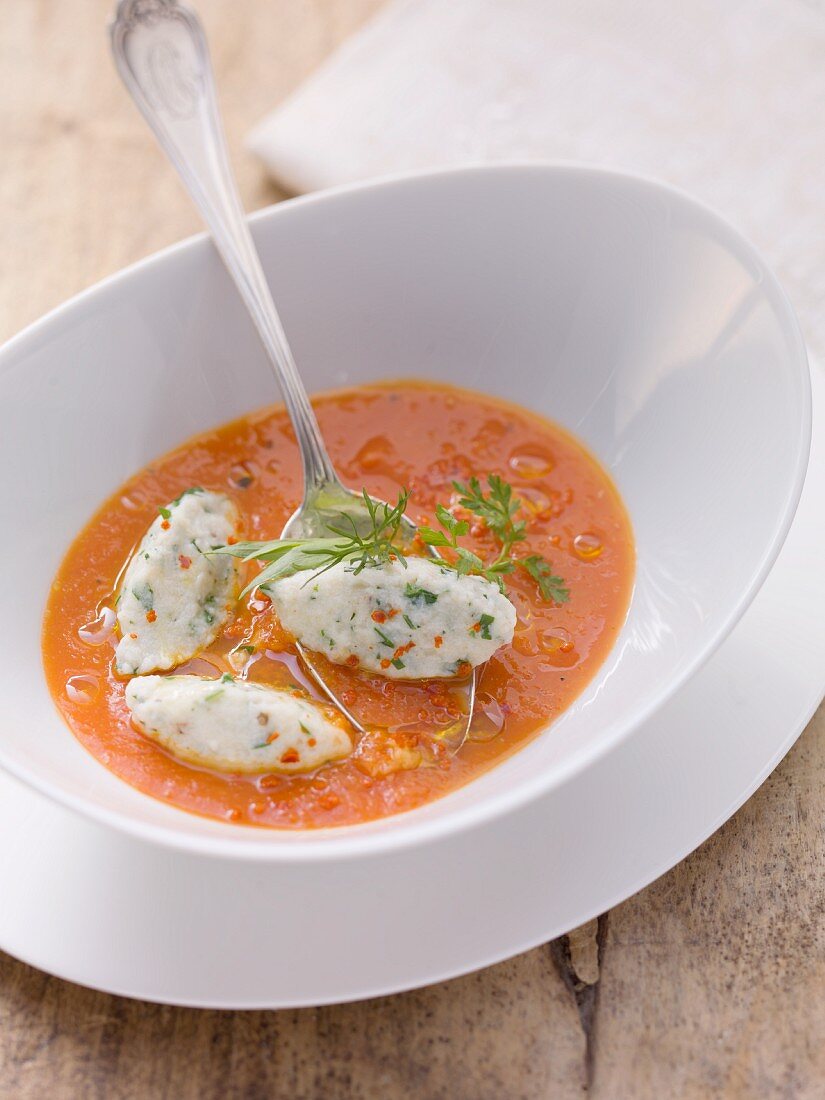 Tomato soup with cheese and herb dumplings