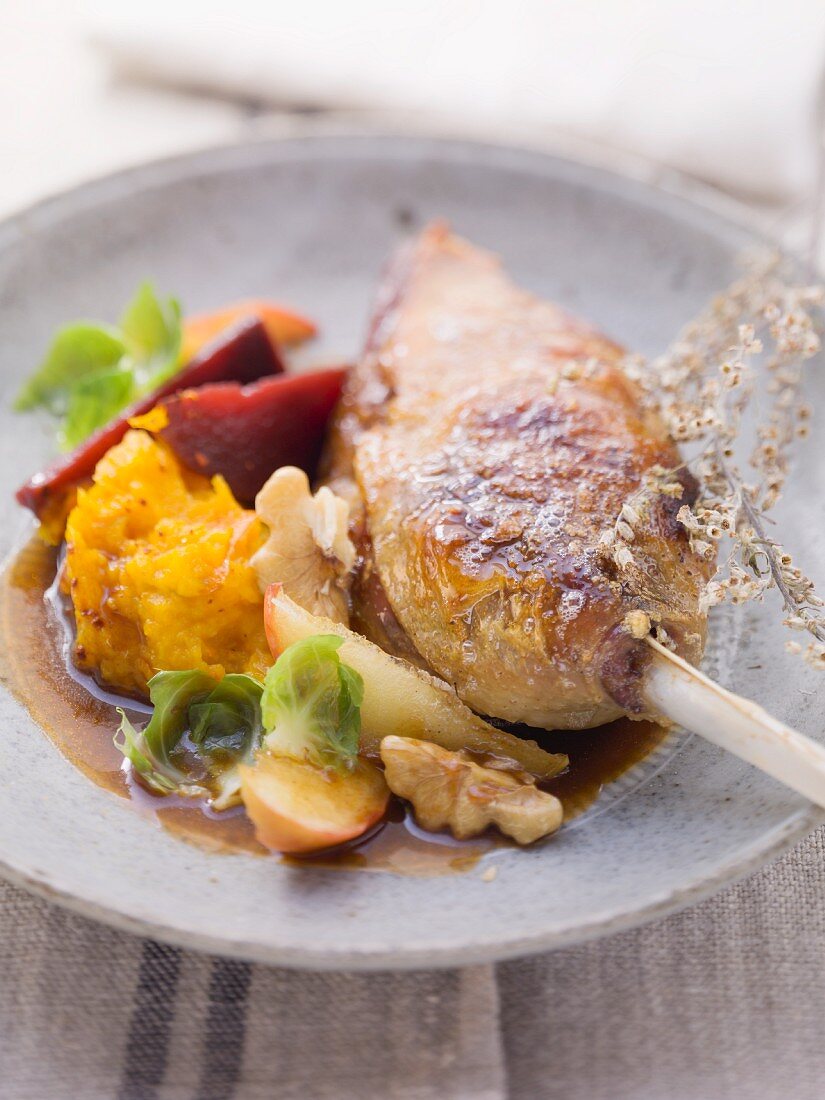 Goose leg with a fruity Brussels sprouts medley and pumpkin puree