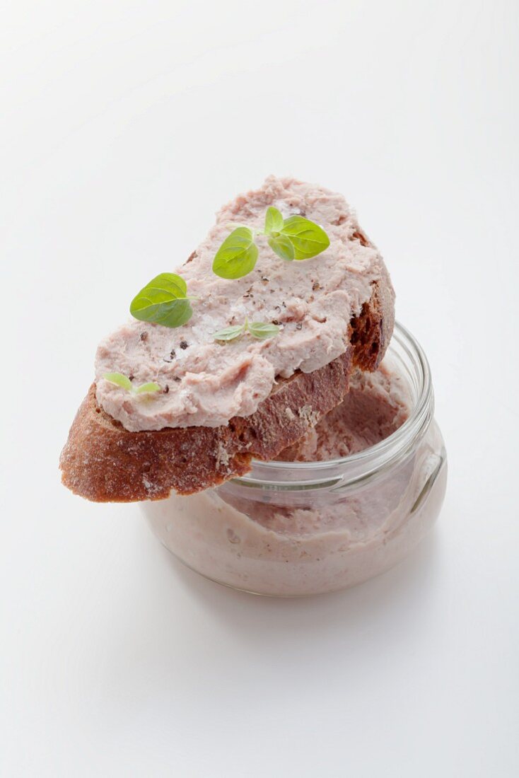 Liver sausage in jar and on bread