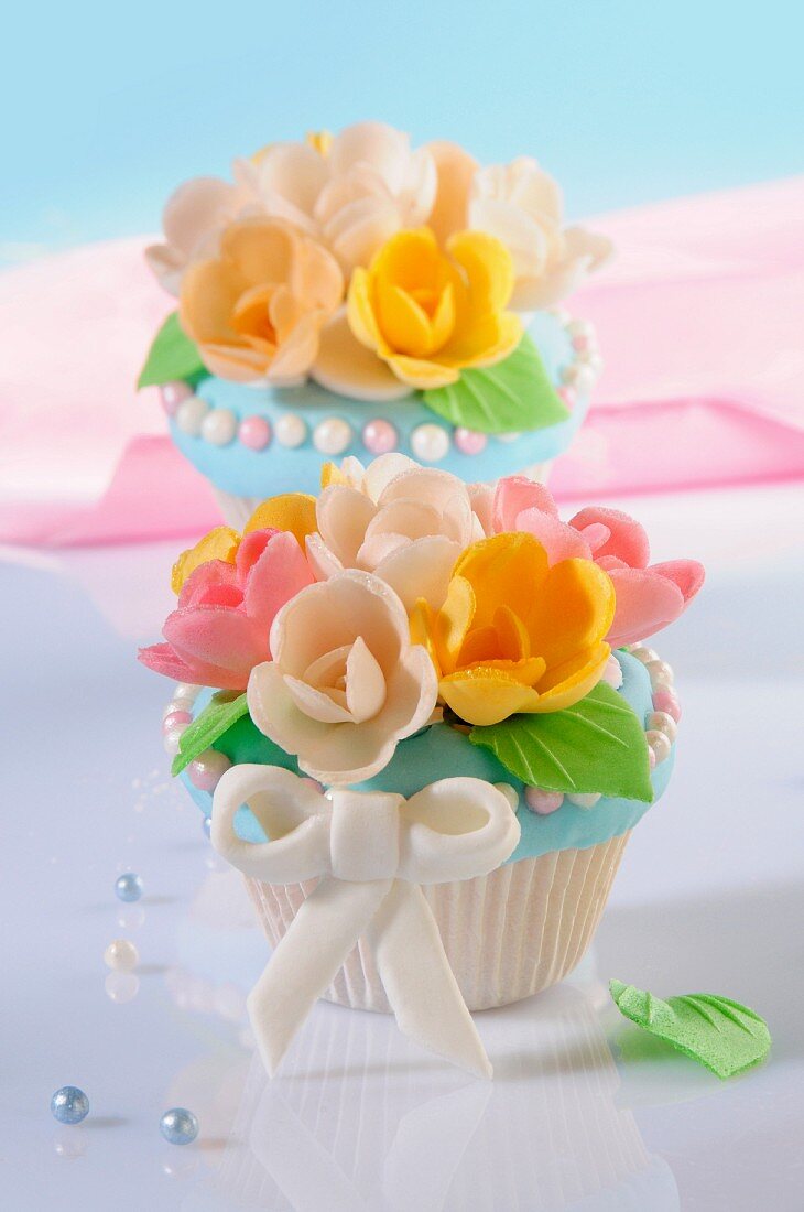 Cupcakes decorated with marzipan flowers