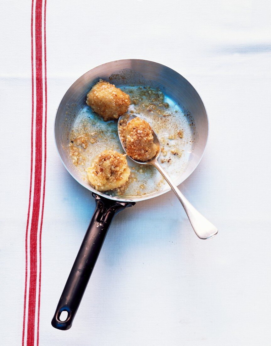 Fried potato dumplings in a pan