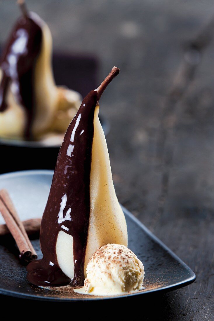Poached pears with chocolate sauce and cinnamon ice cream