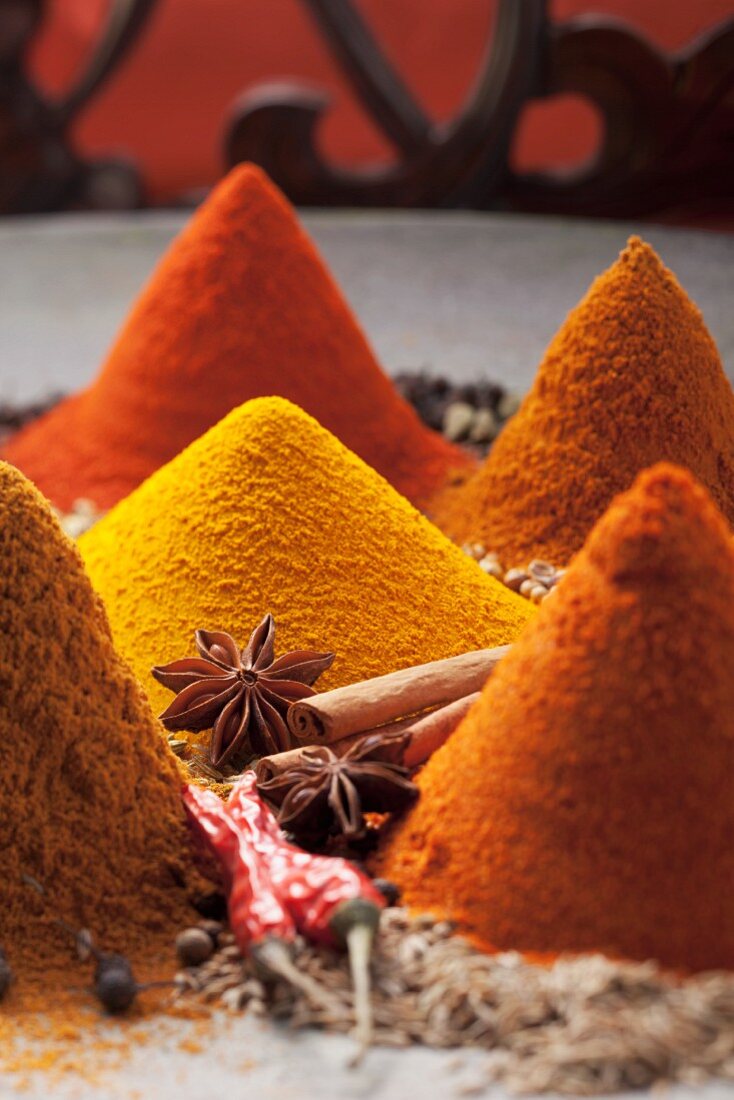 An arrangement of piles of spices