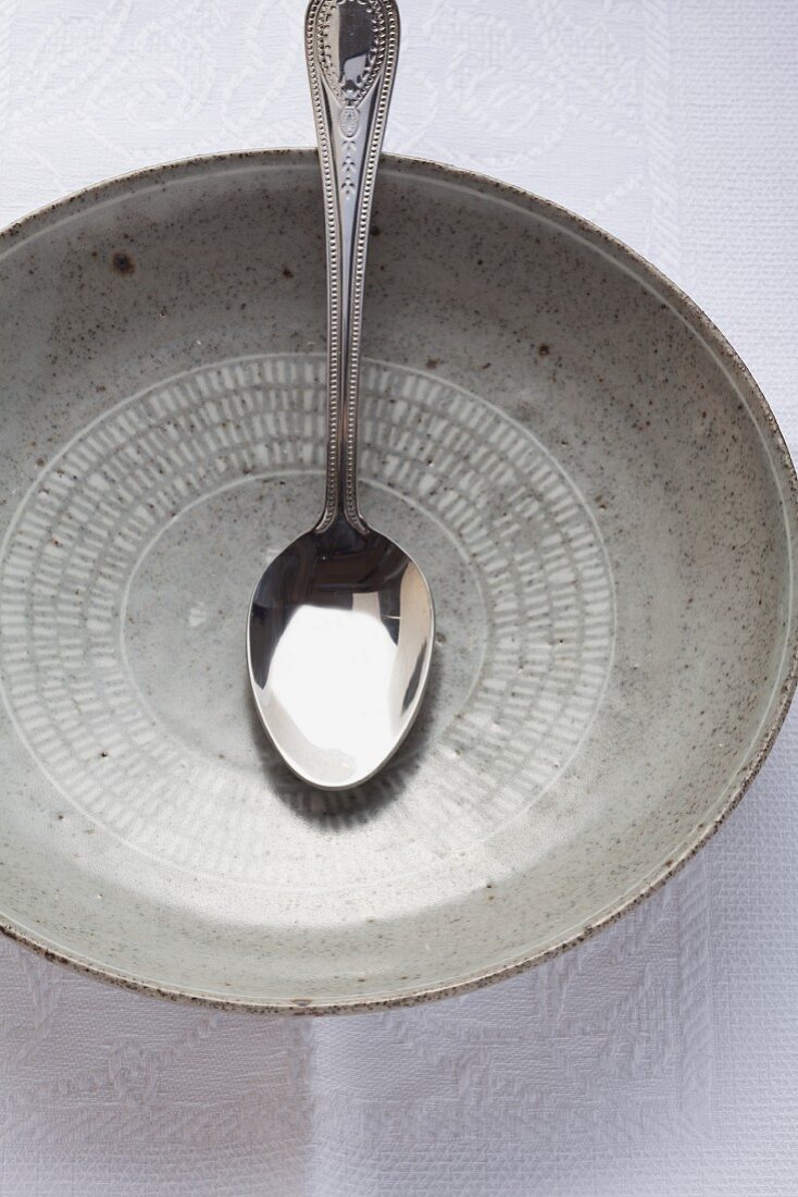 A spoon in a grey dish