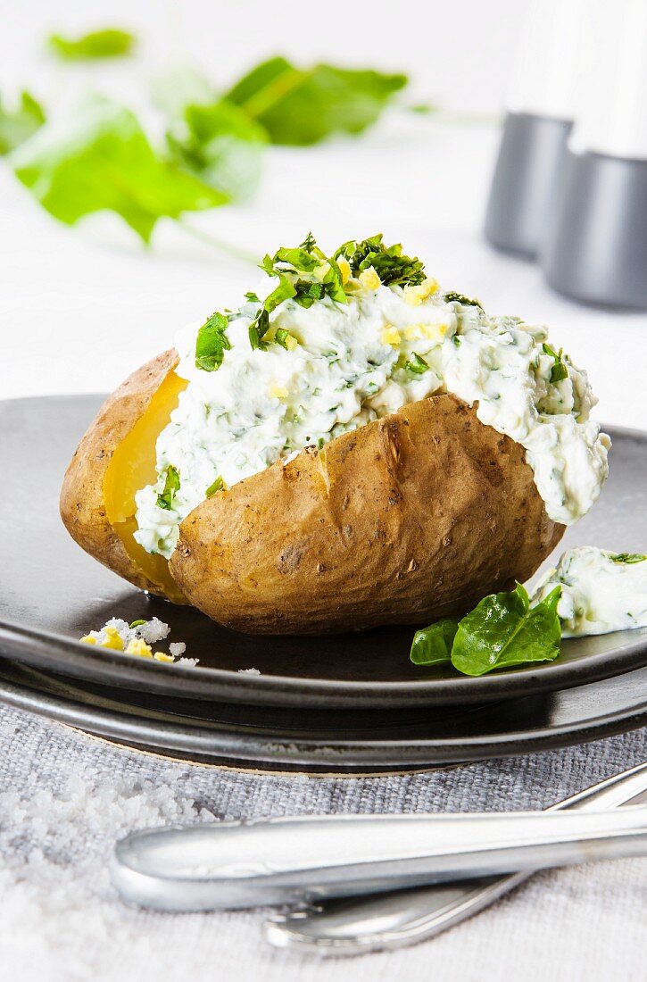 A baked potato with herb quark