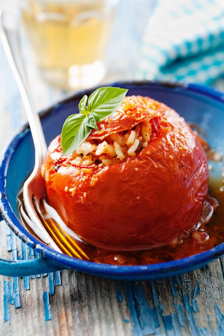 A braised tomato filled with rice