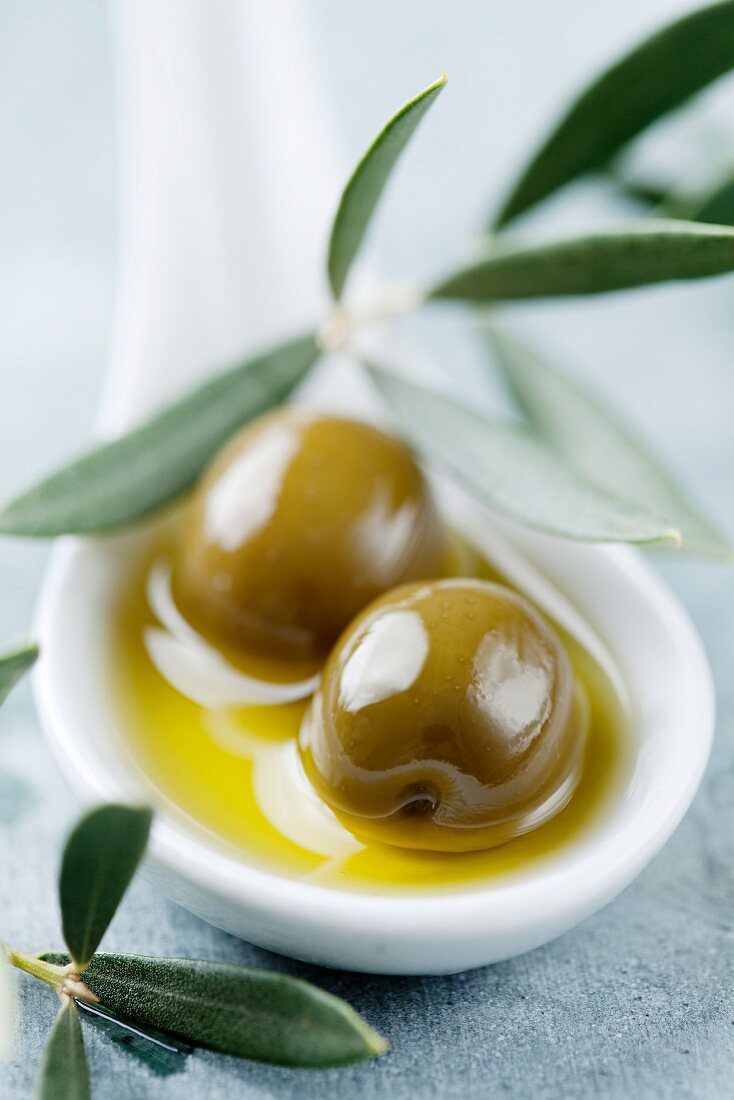 Two olives in olive oil