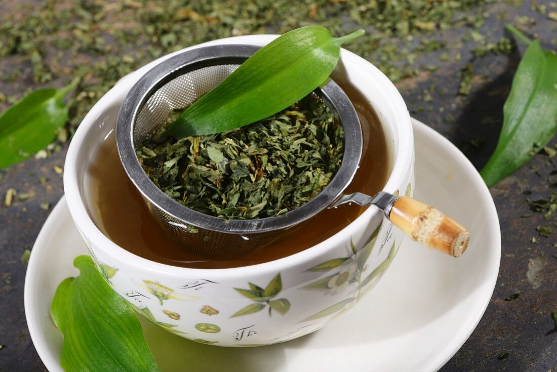 Ramson tea with a tea strainer