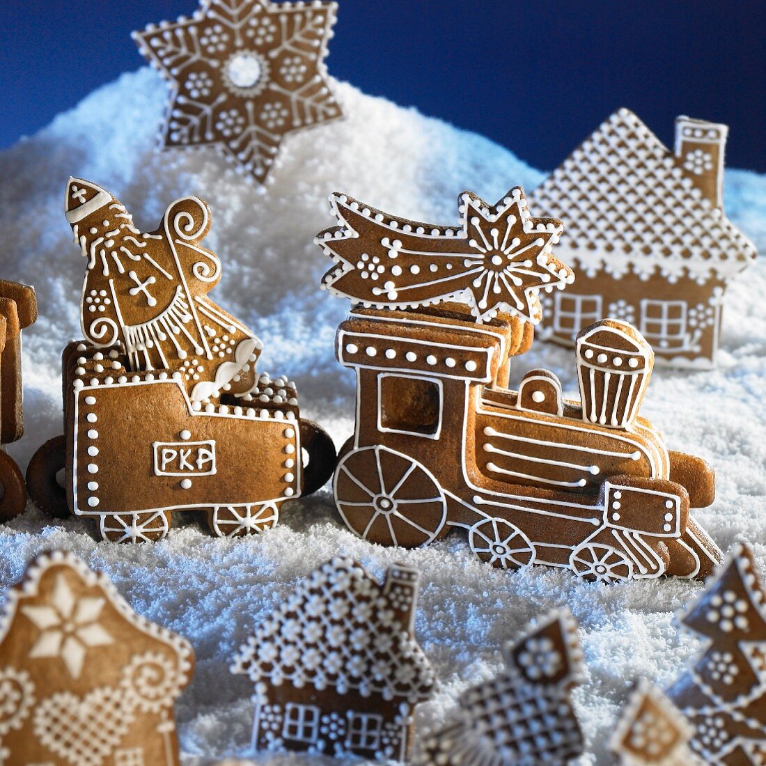 A gingerbread Christmas scene with a steam train