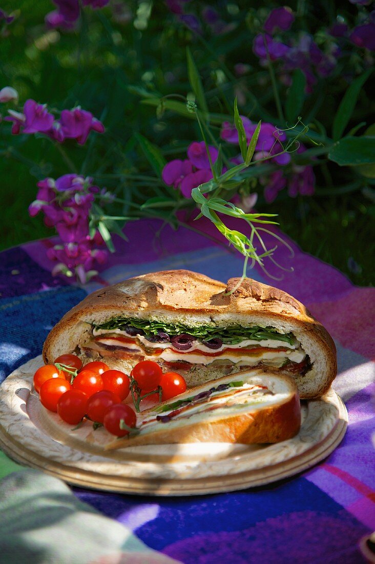 Muffalata sandwich with cherry tomatoes