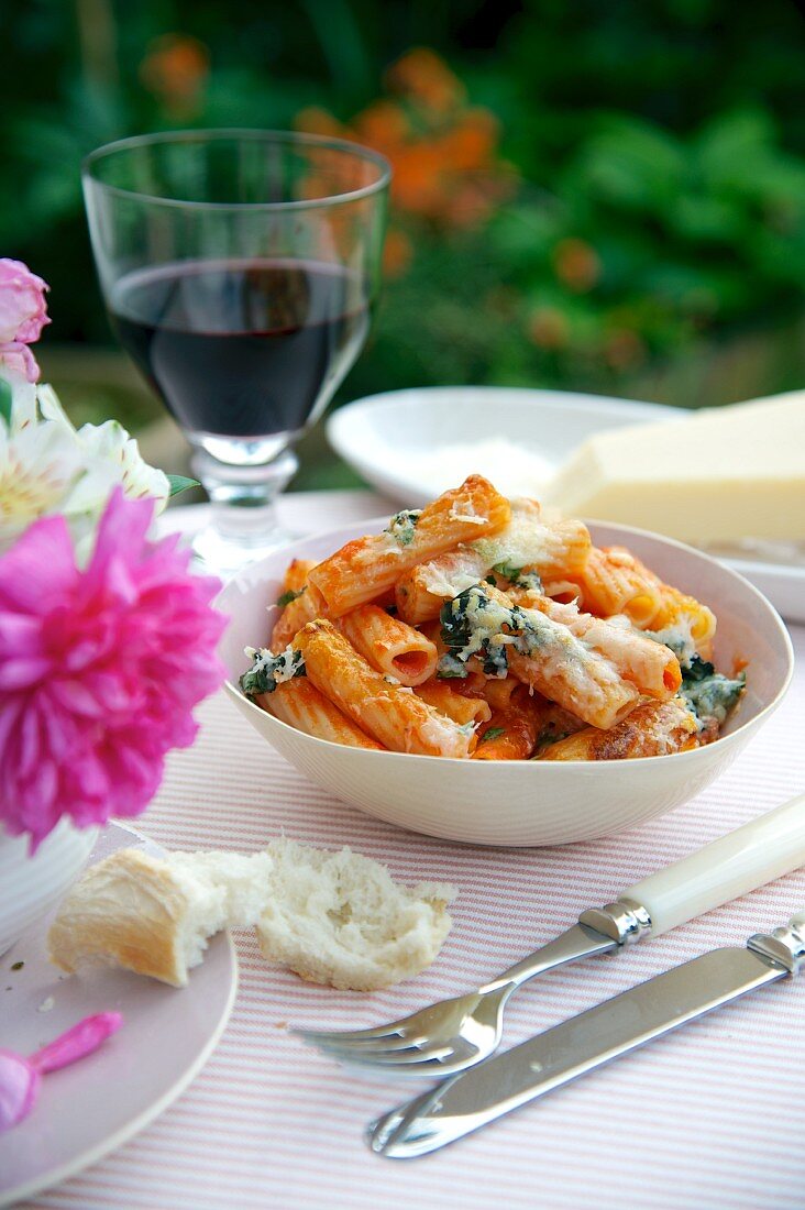 Rigatoni with tomatoes and basil, topped with melted cheese