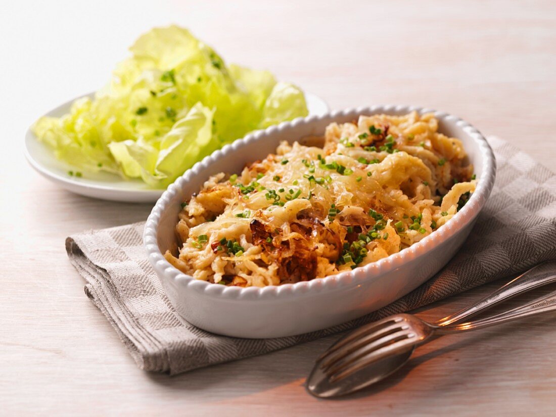 Cheese Spätzle (soft egg noodles from Swabia) with lettuce