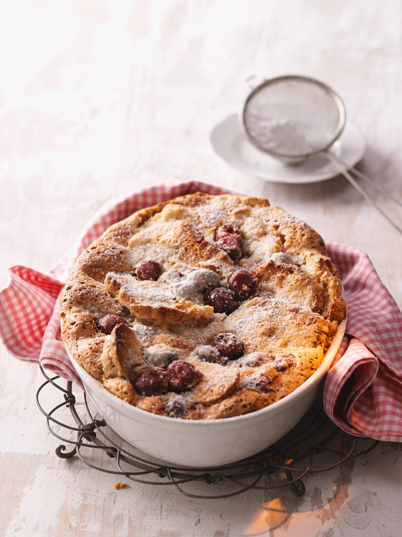 Kirschmichel (cherry bread pudding) dusted with icing sugar