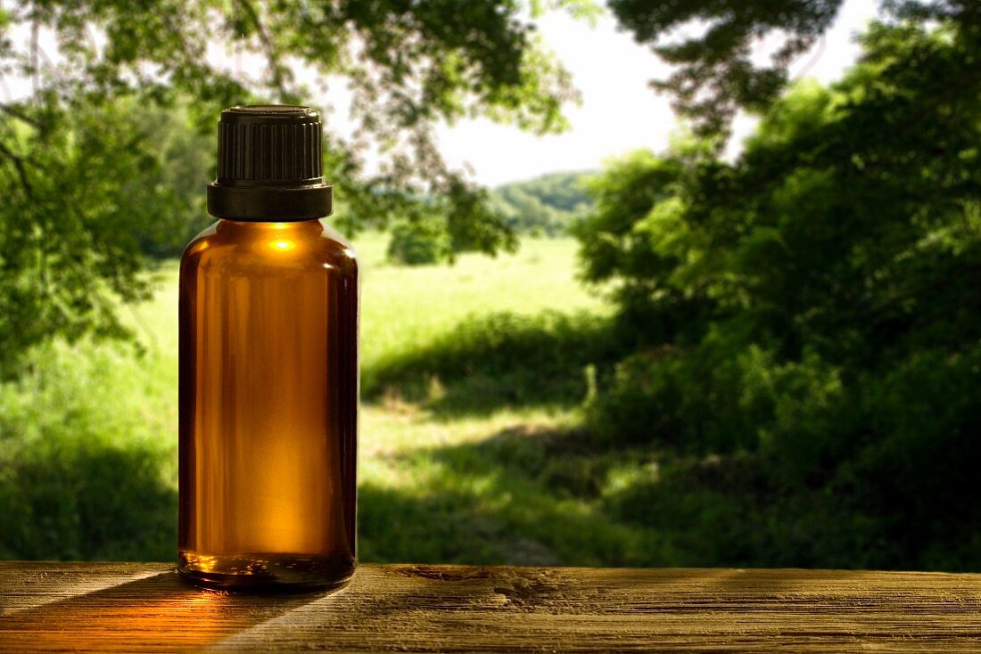 A Bottle of Fragrance Oil on a Windowsill