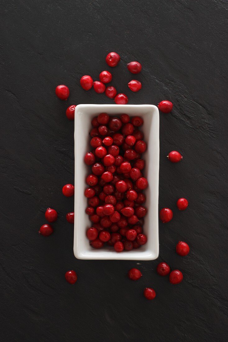 Lingonberries in a dish and on a slate platter