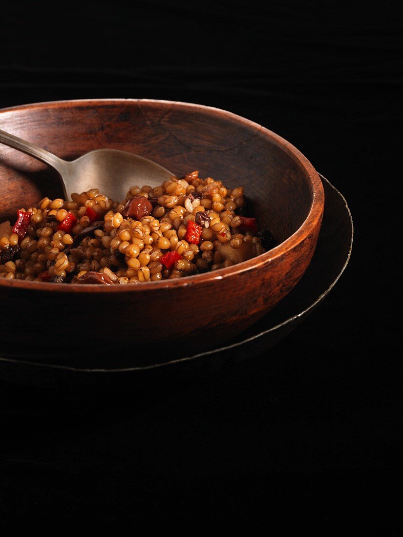 Wheat Berry Salad in a Wooden Bowl with a Spoon