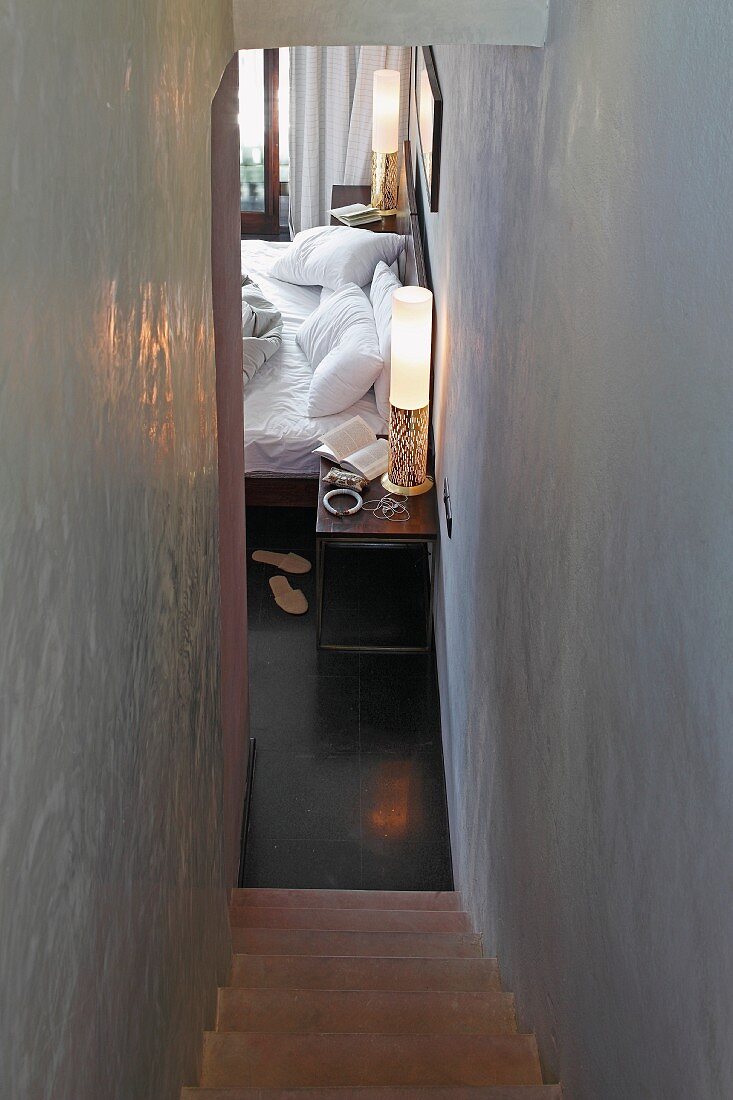 Narrow staircase with view into guest room in Raas Haveli Hotel, Jodhpur, India