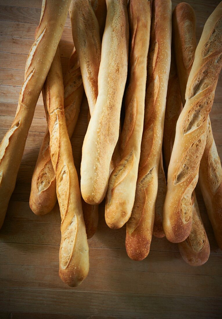 Many Baguettes on a Wooden Table