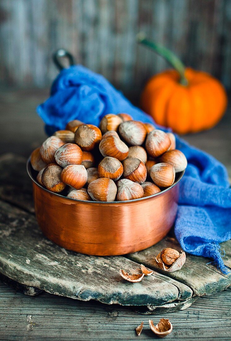 Hazelnuts in a copper pot