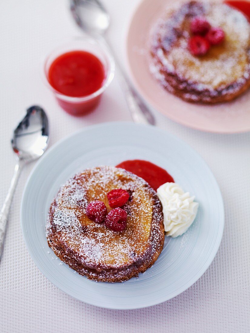 Mille feuilles with icing sugar and raspberries