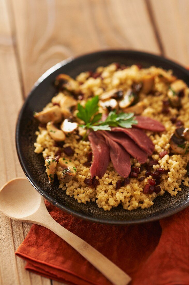 Millet with duck breast
