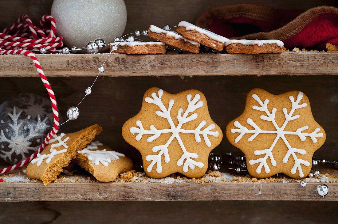 Gingerbread stars on a wooden shelf for Christmas