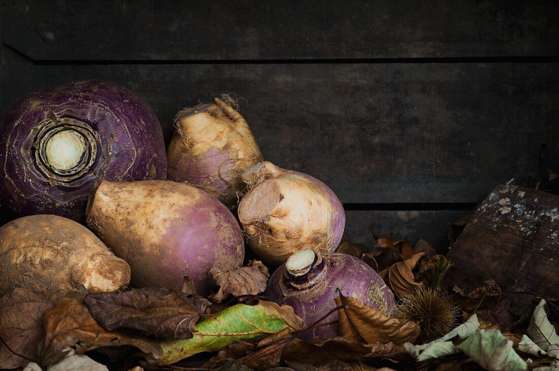 Turnips in a crate of autumn leaves