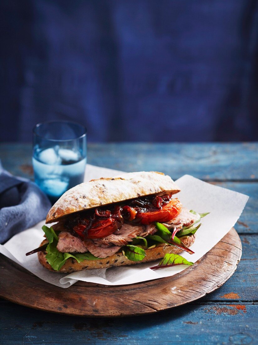 An oven-roasted tomato and beef steak sandwich
