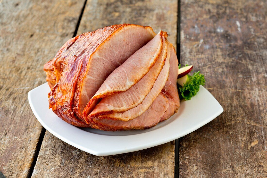 Partially Sliced Baked Ham on a Serving Platter