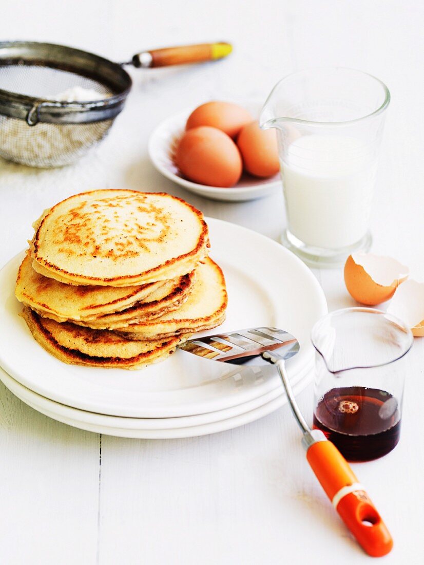 A stack of pancakes with ingredients