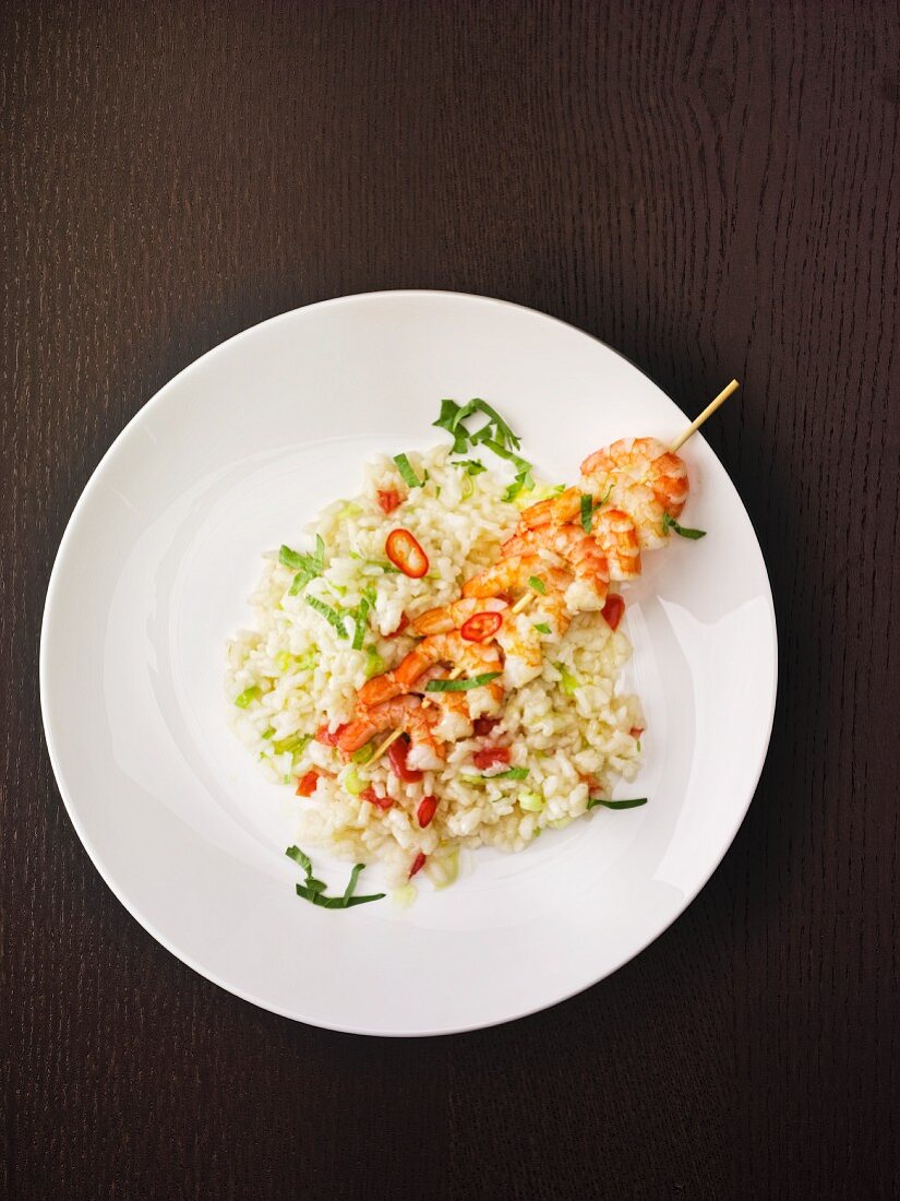 Risotto with a skewer of prawns