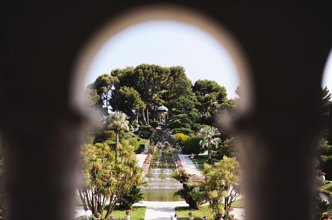 French gardens with round pool, fountain and pagoda