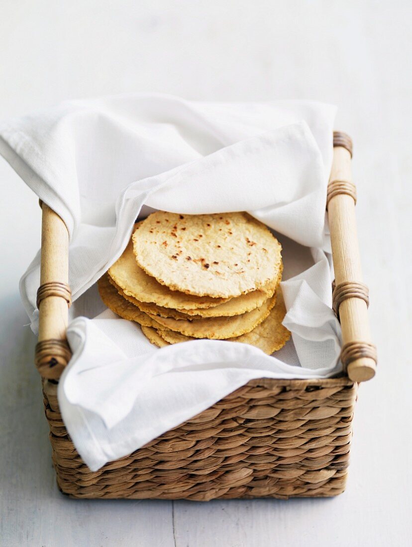 A stack of tortillas in a basket